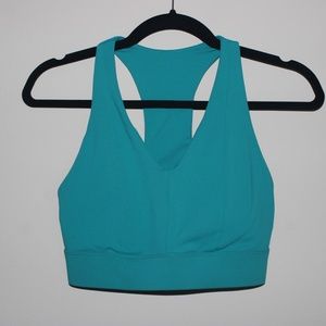 Fabletics On-the-Go Midi Medium Impact Sports Bra in Dark Jade